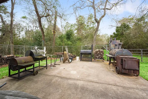 a view of chair and tables in the back yard of the house