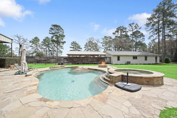 a view of a swimming pool with a patio