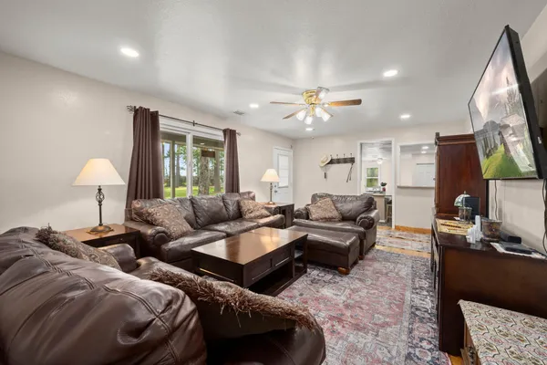 a living room with furniture and a flat screen tv