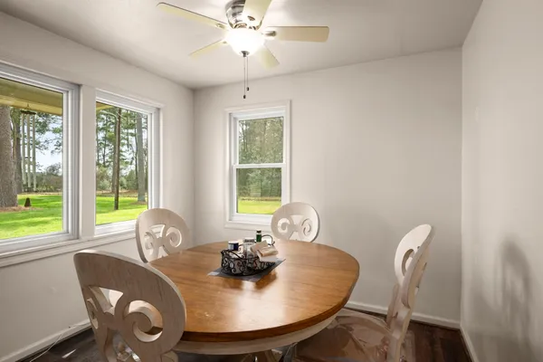 a view of a dining room with furniture window and outside view