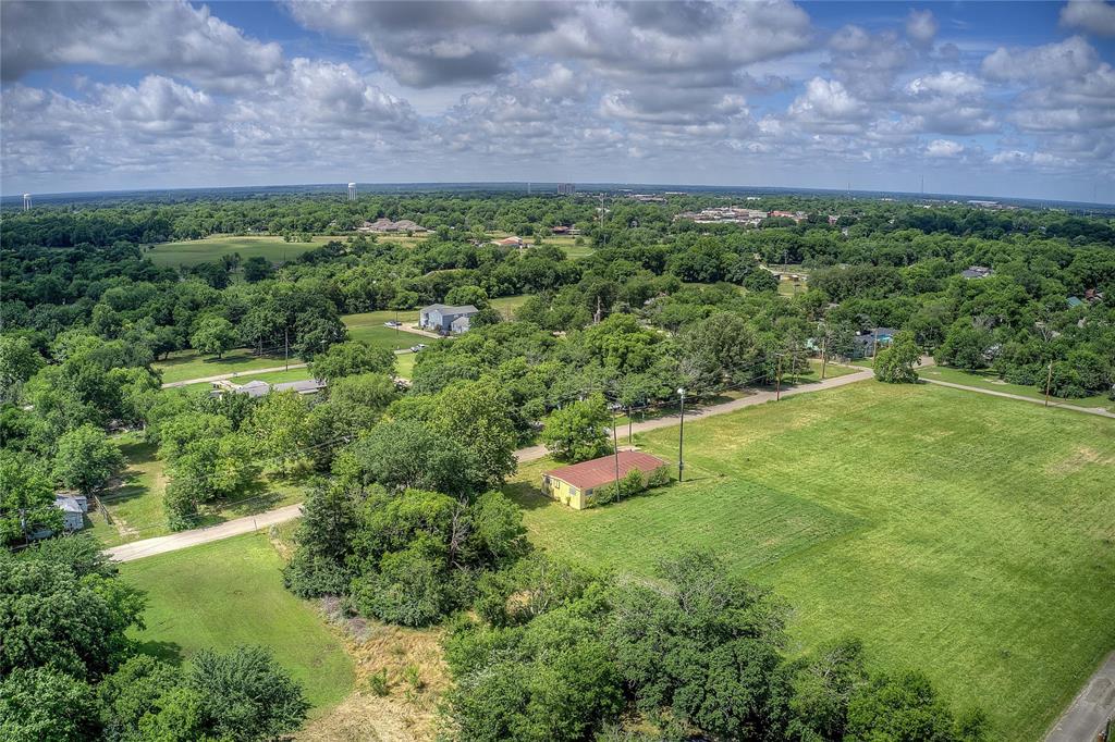 414 North Neal Street Commerce, TX 75428 - Photo 4 of 13 a view of a lush green field