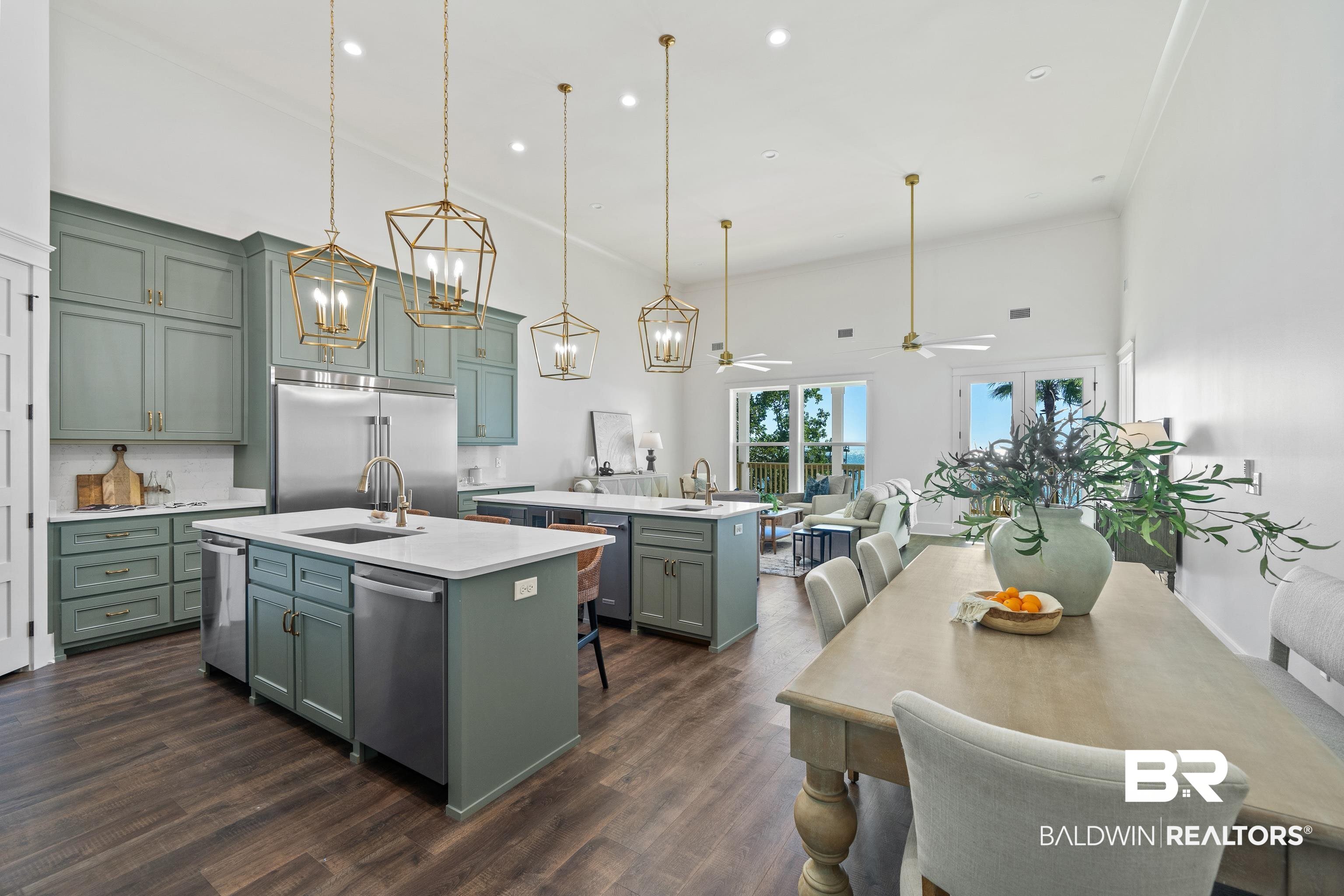 12453 County Road 1 Fairhope, AL 36532 - Photo 8 of 33 Kitchen with stainless steel appliances, ceiling fan, a kitchen island with sink, decorative light fixtures, and dark hardwood / wood-style floors