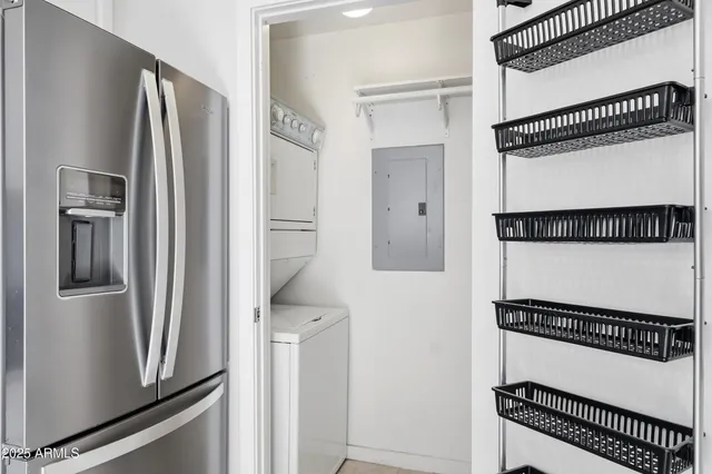 a kitchen with a refrigerator and a stove