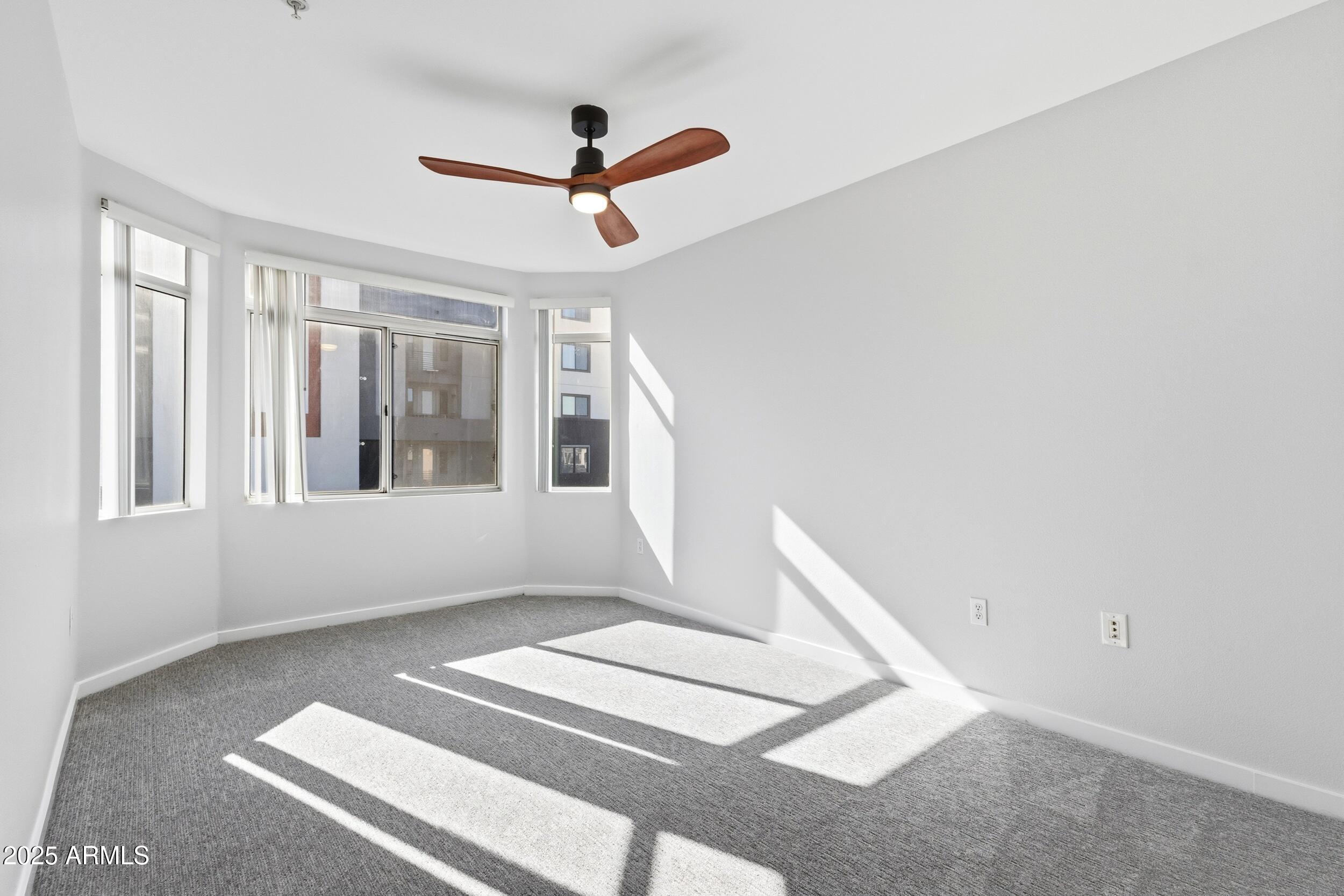 3633 North 3rd Avenue, Unit 2009 Phoenix, AZ 85013 - Photo 21 of 36 a view of an empty room with a window