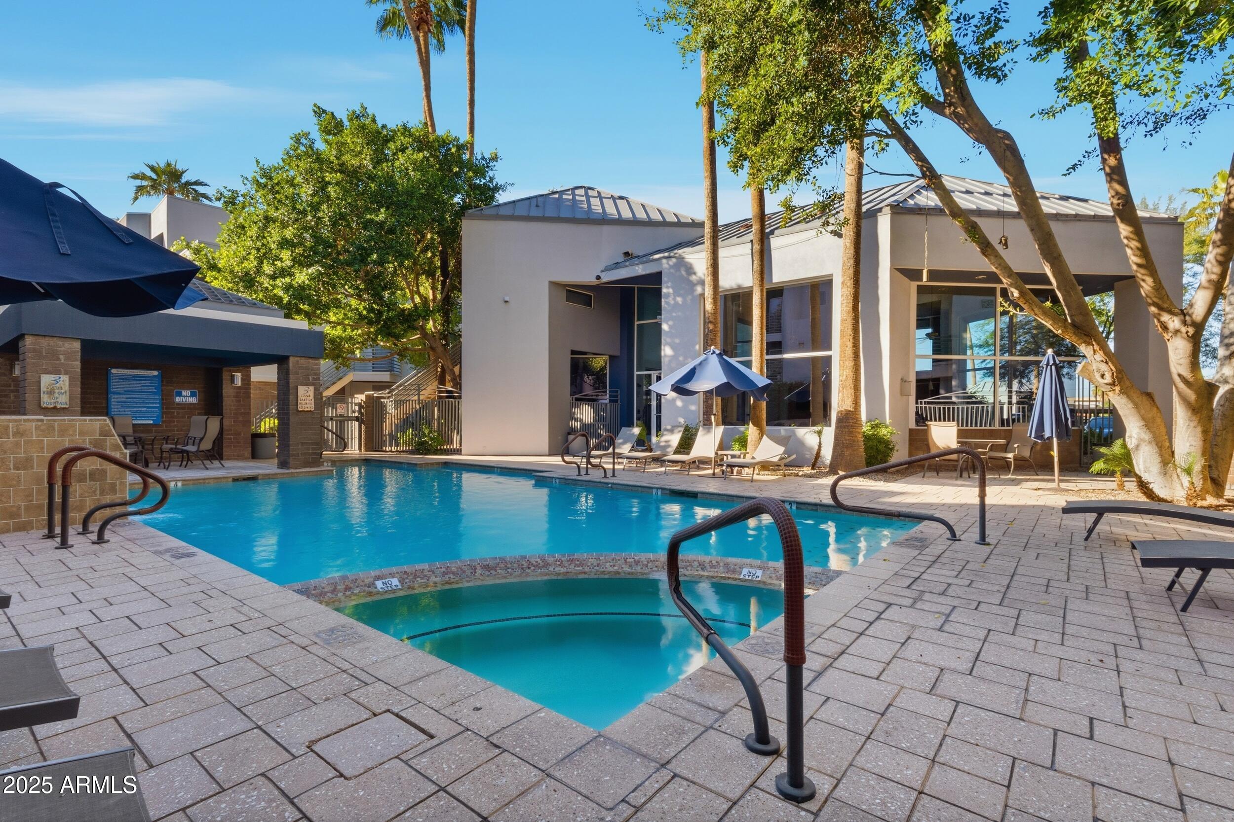 3633 North 3rd Avenue, Unit 2009 Phoenix, AZ 85013 - Photo 28 of 36 a swimming pool with outdoor seating and yard