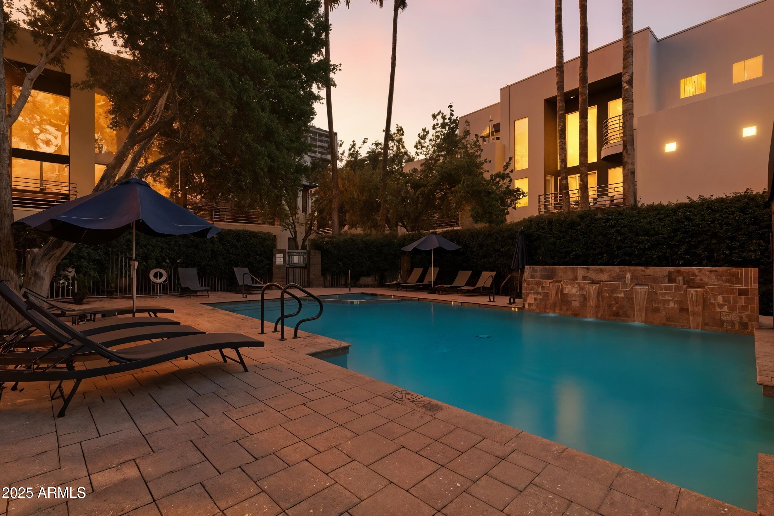 3633 North 3rd Avenue, Unit 2009 Phoenix, AZ 85013 - Photo 5 of 36 a backyard of a house with wooden floor and outdoor seating