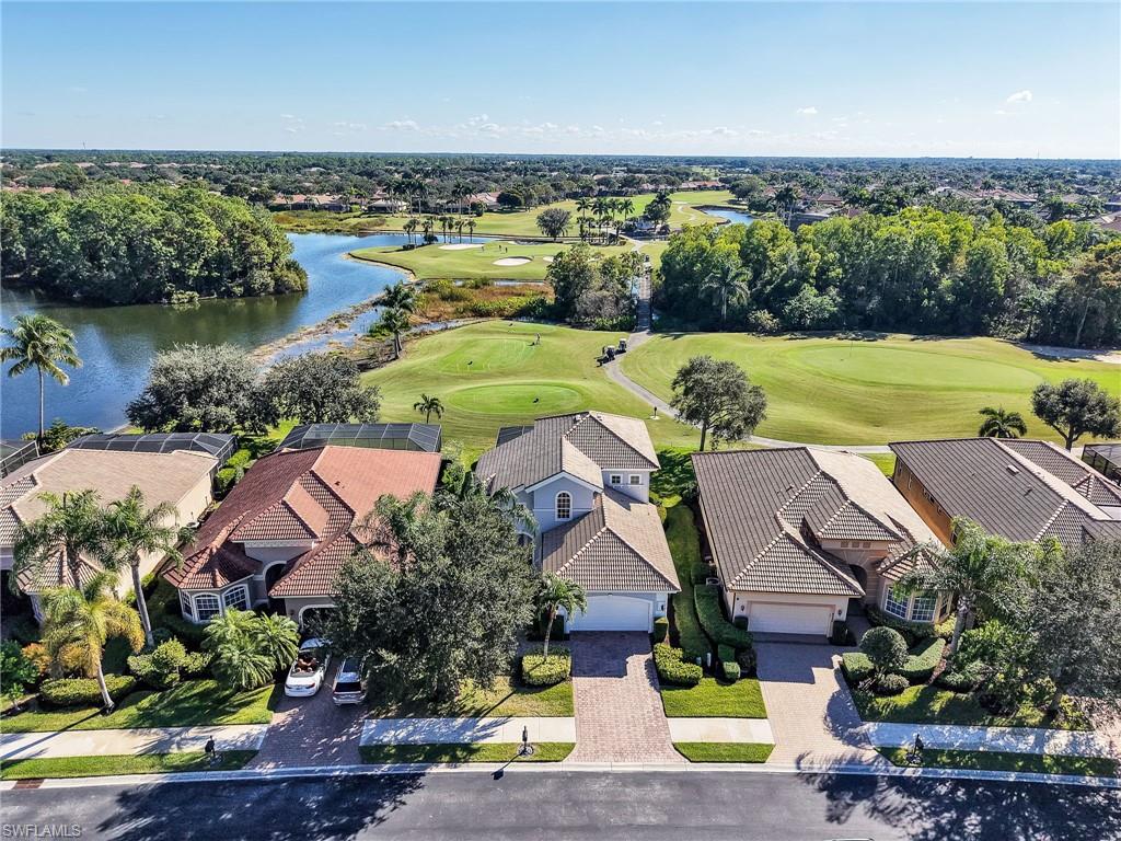 6096 Dogleg Drive Naples, FL 34113 - Photo 16 of 49 an aerial view of residential houses with outdoor space and river