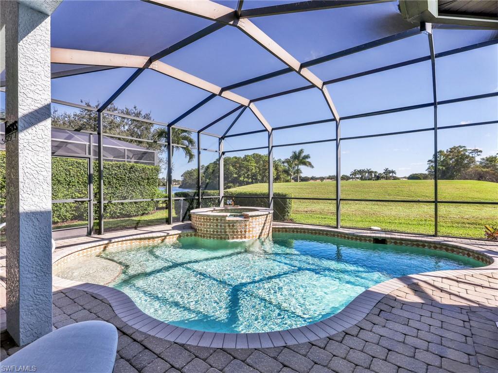 6096 Dogleg Drive Naples, FL 34113 - Photo 17 of 49 a view of a backyard with sitting area