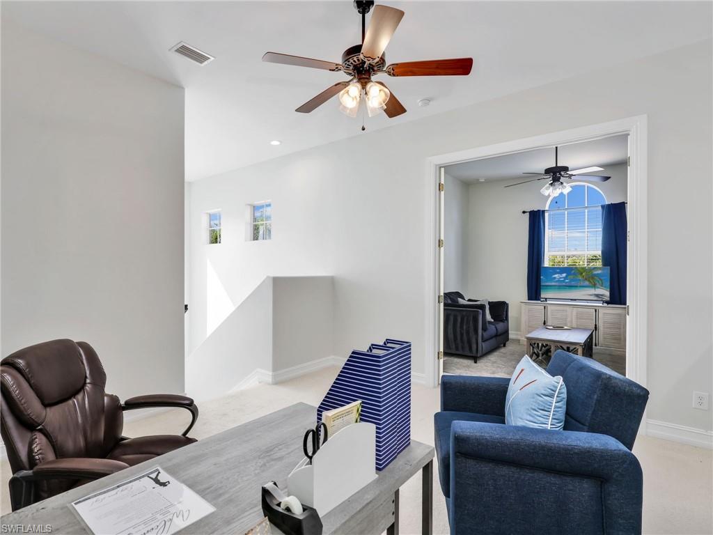 6096 Dogleg Drive Naples, FL 34113 - Photo 26 of 49 a living room with furniture