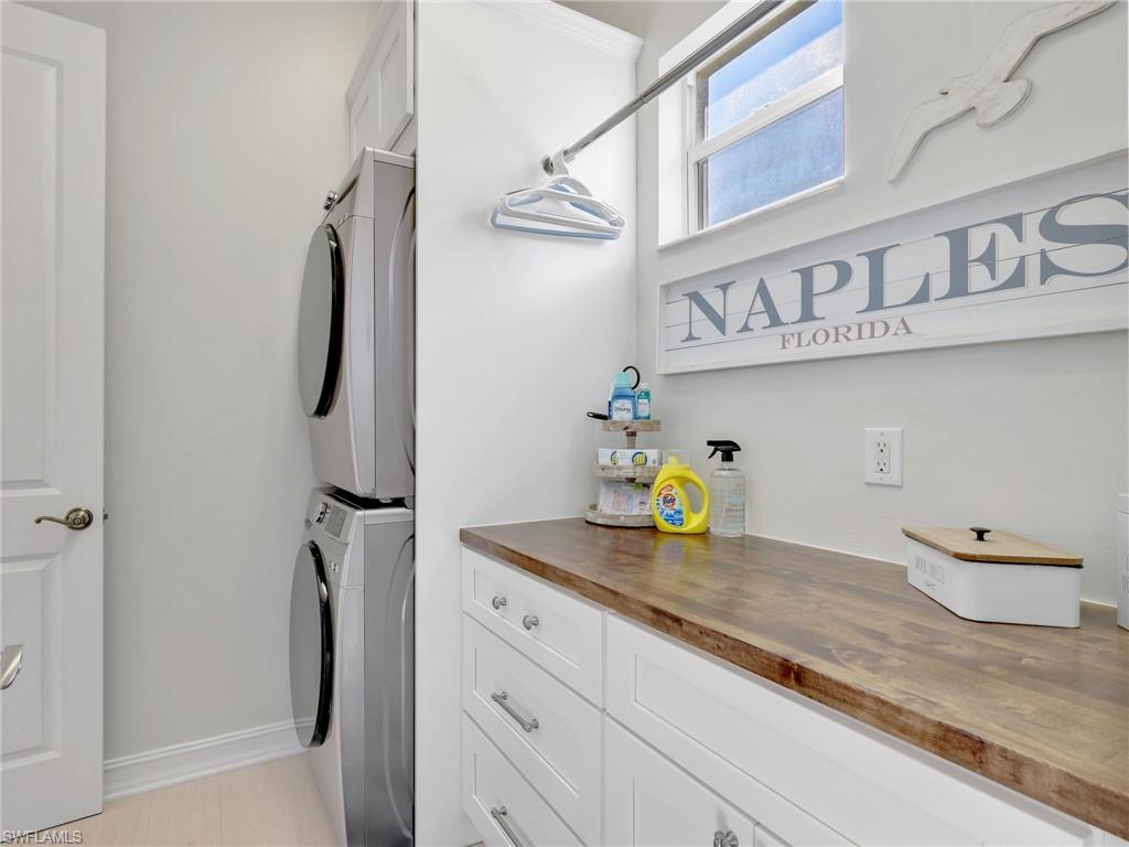 6096 Dogleg Drive Naples, FL 34113 - Photo 42 of 49 a bathroom with a granite countertop sink and a granite top
