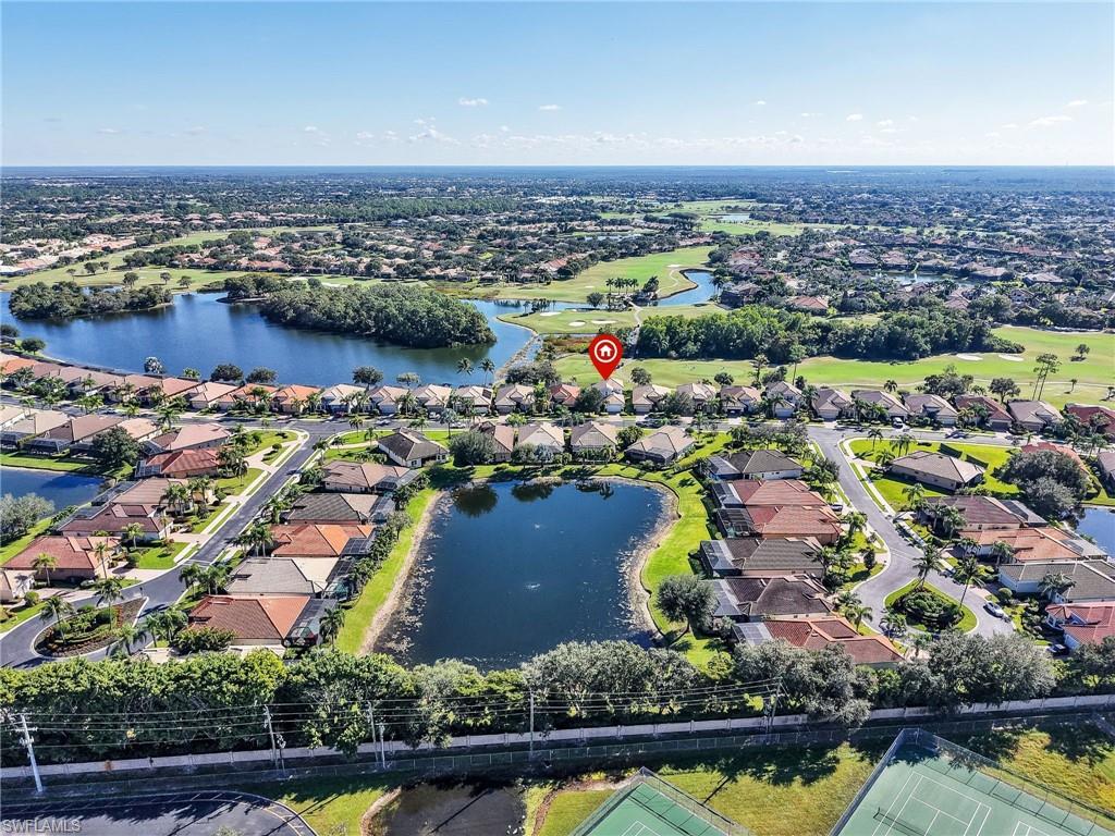 6096 Dogleg Drive Naples, FL 34113 - Photo 44 of 49 an aerial view of residential building and lake
