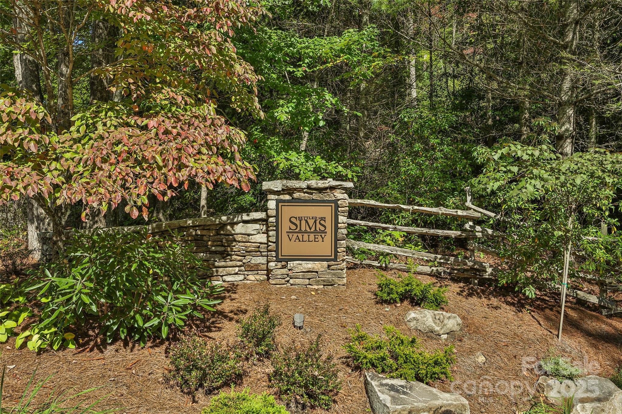 Lot 39 Sweet Spring Trail, Unit 39 Glenville, NC 28736 - Photo 12 of 27 a view of a bench in a garden