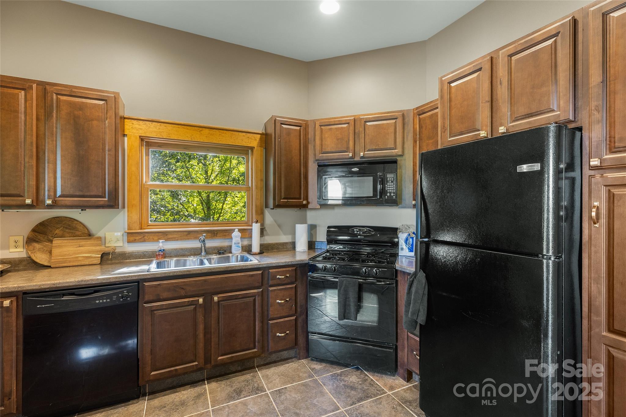 Lot 39 Sweet Spring Trail, Unit 39 Glenville, NC 28736 - Photo 24 of 27 a kitchen with a sink appliances and cabinets