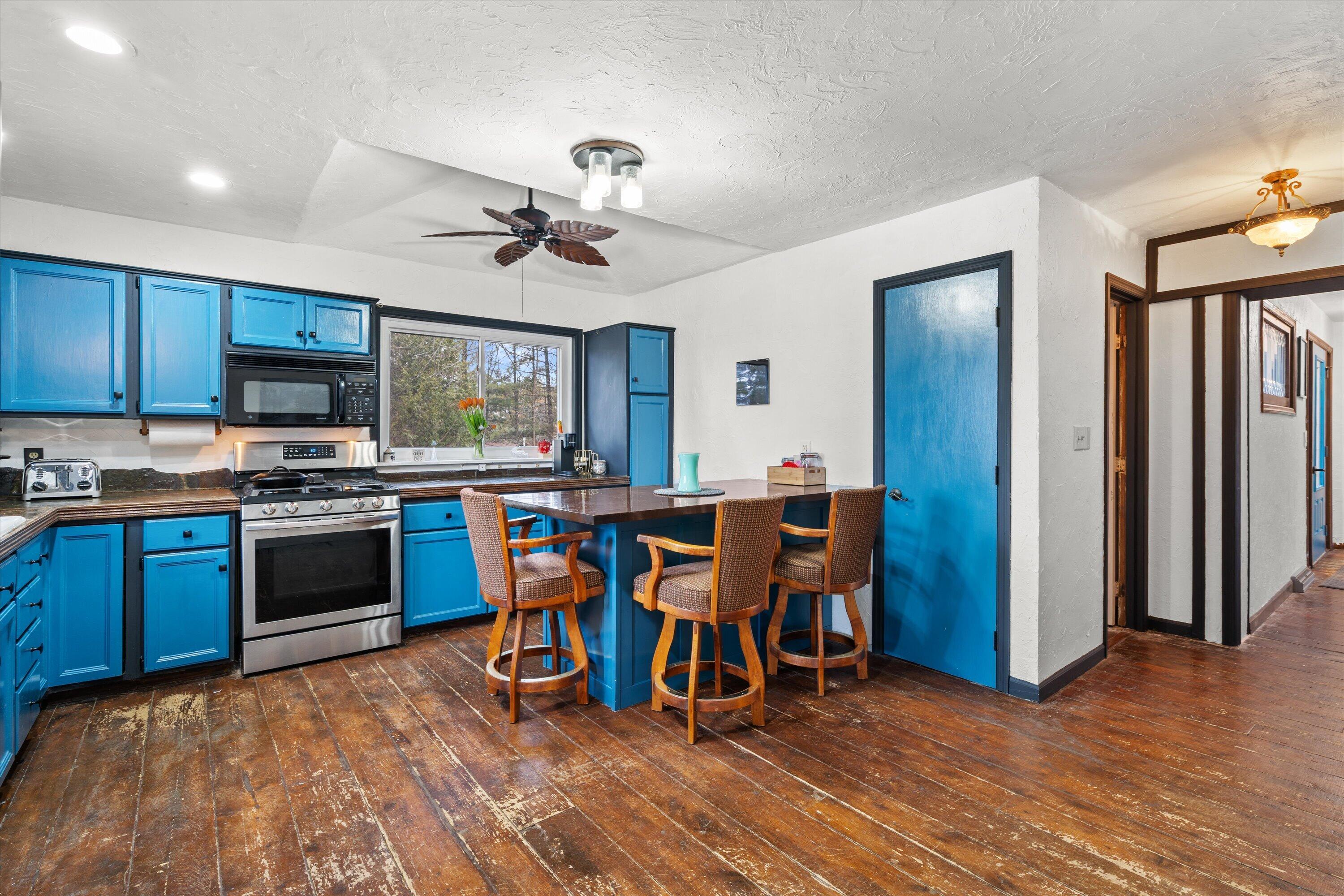 4804 County Hwy VV Two Rivers, WI 54241 - Photo 14 of 60 Large kitchen with barn wood floors & SS gas appliances
