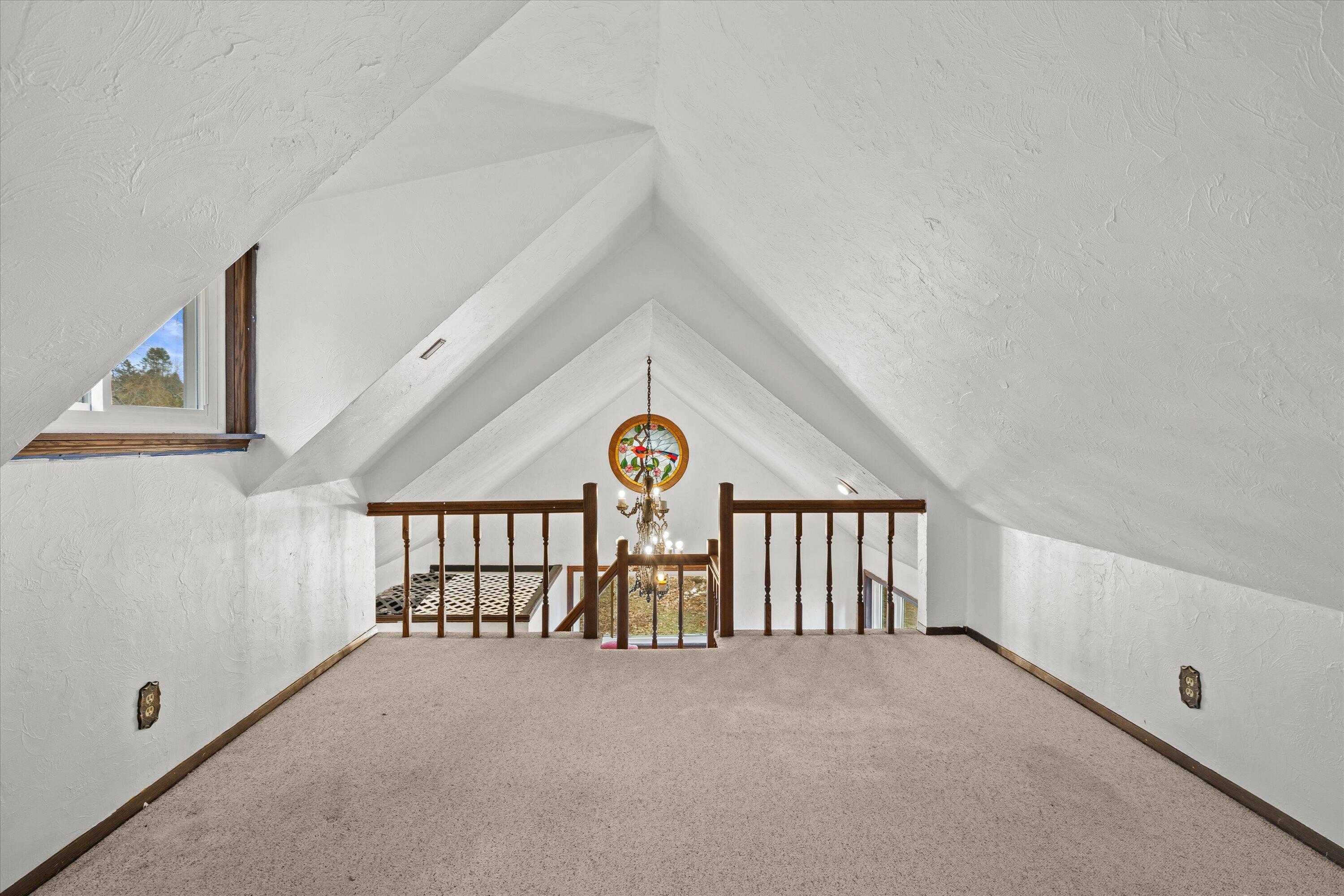 4804 County Hwy VV Two Rivers, WI 54241 - Photo 18 of 60 Main level-Lofted space & circular stained glass window