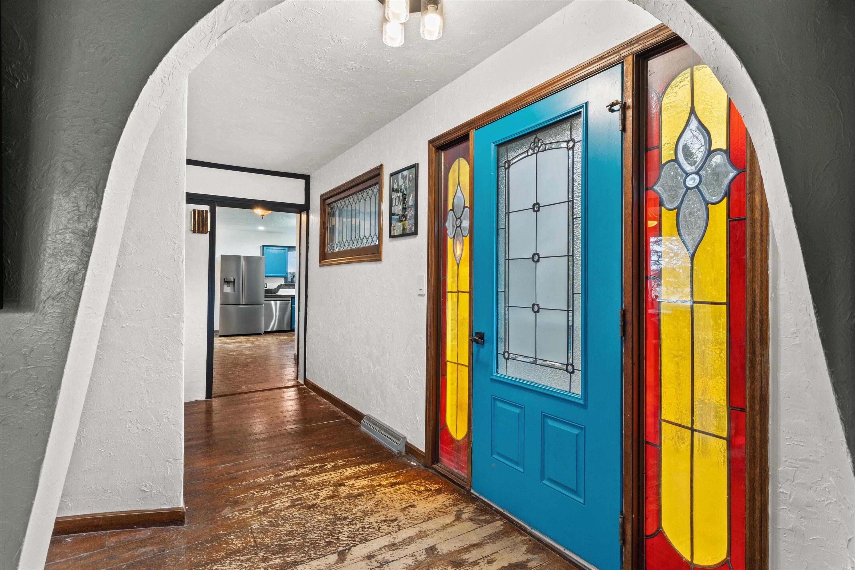 4804 County Hwy VV Two Rivers, WI 54241 - Photo 6 of 60 Thoughtful attention to detail throughout, filled with timeless character. Foyer framed w/stained glass sidelight