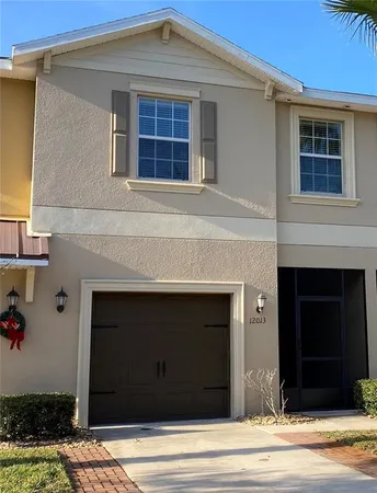 a front view of a house with garage