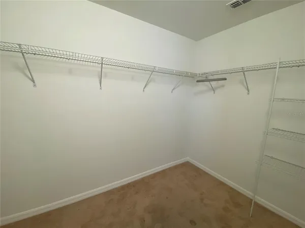 a view of a room with racks on the wall