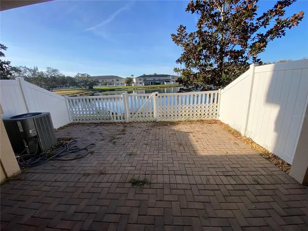 a view of balcony with wooden floor and fence