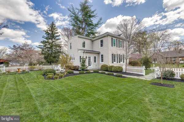 an aerial view of a house with a big yard