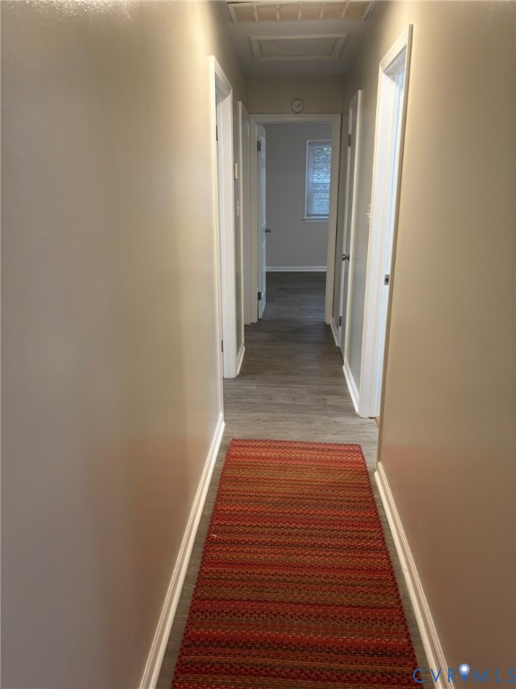 1185 Erica Road Montross, VA 22520 - Photo 17 of 32 Corridor featuring baseboards and light wood-style