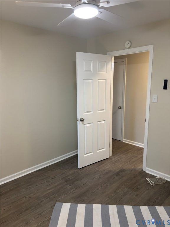 1185 Erica Road Montross, VA 22520 - Photo 20 of 32 Unfurnished bedroom with dark wood-style floors an