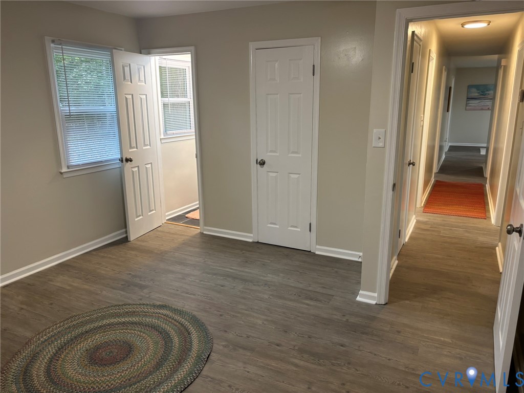 1185 Erica Road Montross, VA 22520 - Photo 23 of 32 Unfurnished bedroom featuring dark wood-style floo