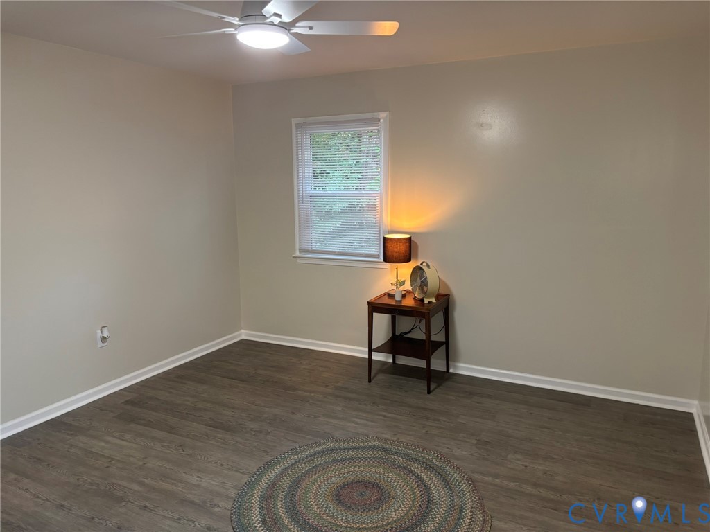 1185 Erica Road Montross, VA 22520 - Photo 25 of 32 Spare room with dark wood-style flooring and ceili