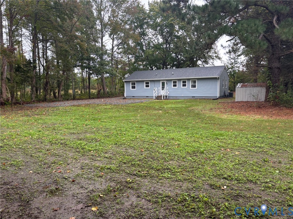 1185 Erica Road Montross, VA 22520 - Photo 28 of 32 Rear view of property featuring crawl space, a law