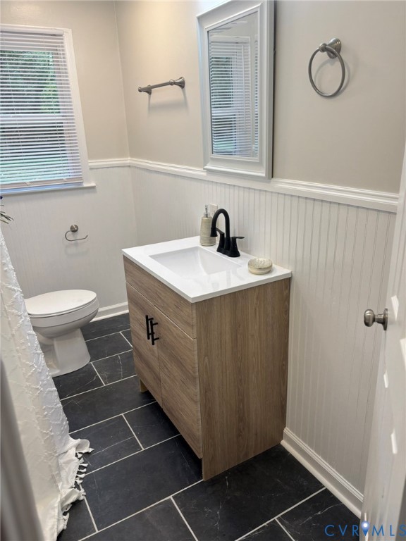 1185 Erica Road Montross, VA 22520 - Photo 31 of 32 Bathroom with vanity and wainscoting