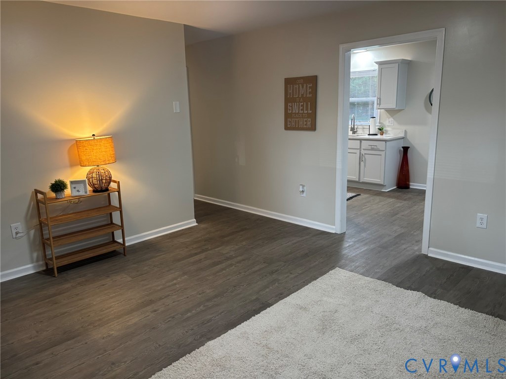 1185 Erica Road Montross, VA 22520 - Photo 7 of 32 Living room featuring dark wood-style floors and b