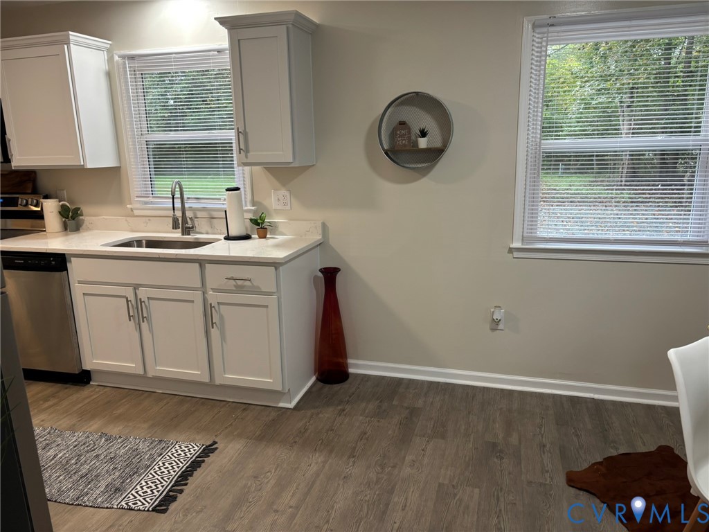 1185 Erica Road Montross, VA 22520 - Photo 10 of 32 Kitchen featuring dark wood-style flooring, stainl