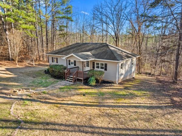 1079 Electric Dam Road Dallas, GA 30132 - Photo 1 of 1 a view of a house with a yard covered with snow and trees