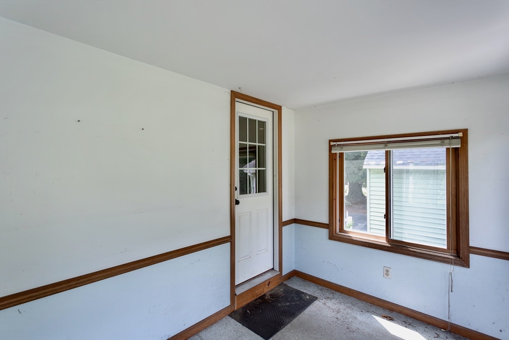 94 Holyoke Road Westfield, MA 01085 - Photo 37 of 42 a view of an empty room with wooden floor and a window