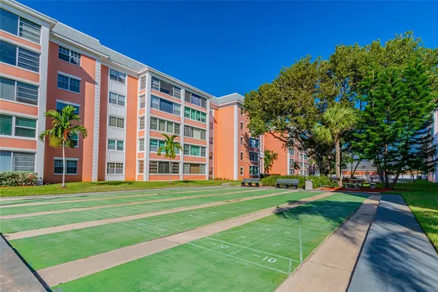 a view of a building with a yard