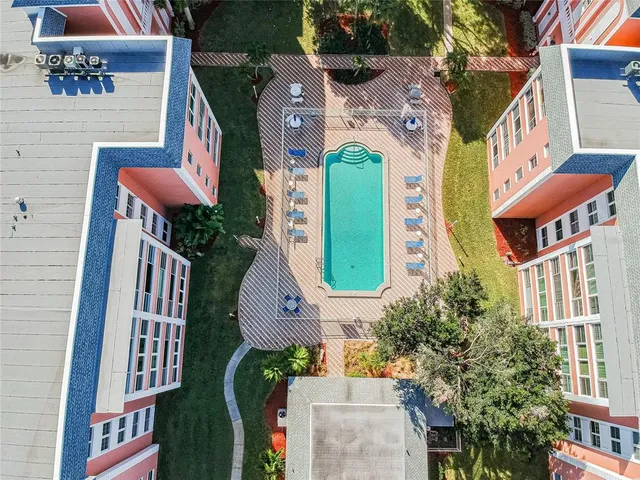 an aerial view of multiple houses with yard