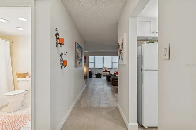 a living room with furniture and a walk in closet