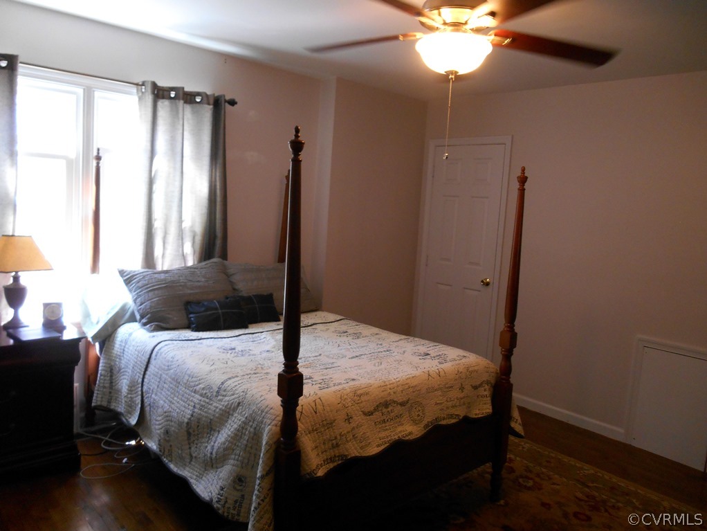 4904 Court Ridge Terrace Midlothian, VA 23112 - Photo 16 of 20 a bedroom with a bed and a chandelier