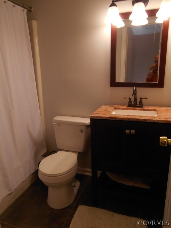 4904 Court Ridge Terrace Midlothian, VA 23112 - Photo 17 of 20 a bathroom with a toilet sink and mirror
