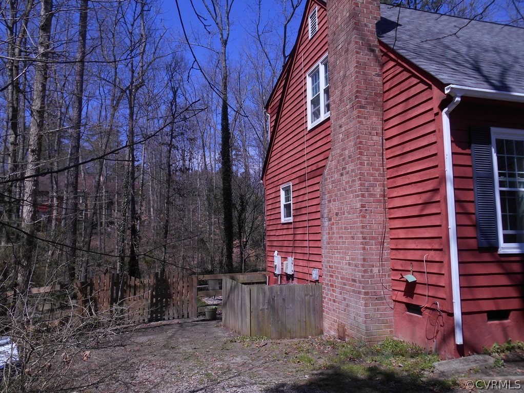 4904 Court Ridge Terrace Midlothian, VA 23112 - Photo 3 of 20 a view of a brick house with a tree in front of it
