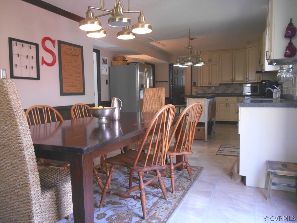 4904 Court Ridge Terrace Midlothian, VA 23112 - Photo 10 of 20 a dining room with furniture and chandelier