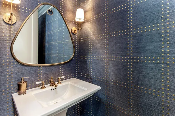 a bathroom with a sink and mirror