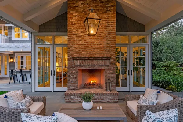 a front view of a house with outdoor seating