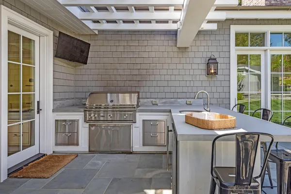 a stove top oven sitting inside of a kitchen