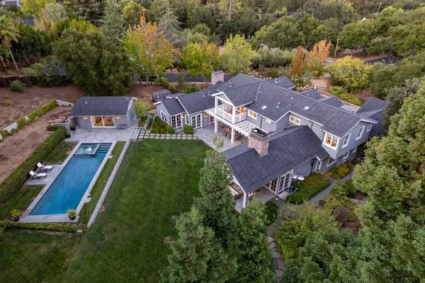 an aerial view of a house with a garden