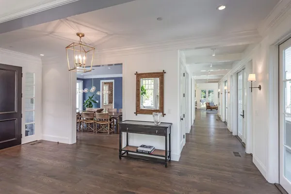 a view of a livingroom with furniture window and wooden floor