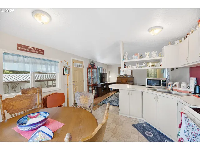 a view of kitchen dining table and chairs