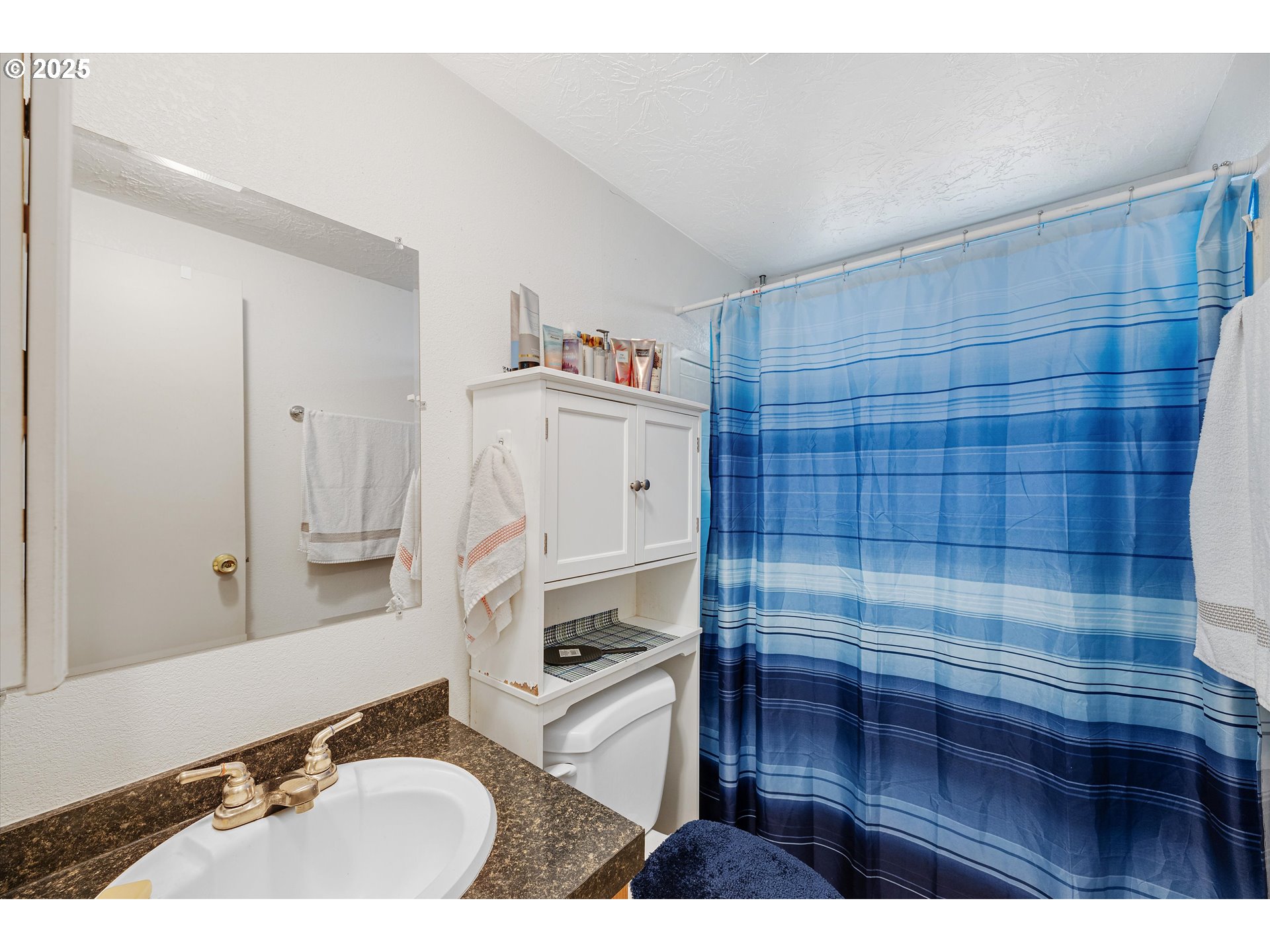 17655 Bluff Road, Unit 42 Sandy, OR 97055 - Photo 20 of 23 a bathroom with a sink a vanity and a shower
