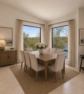a view of a dining room with furniture window and outside view