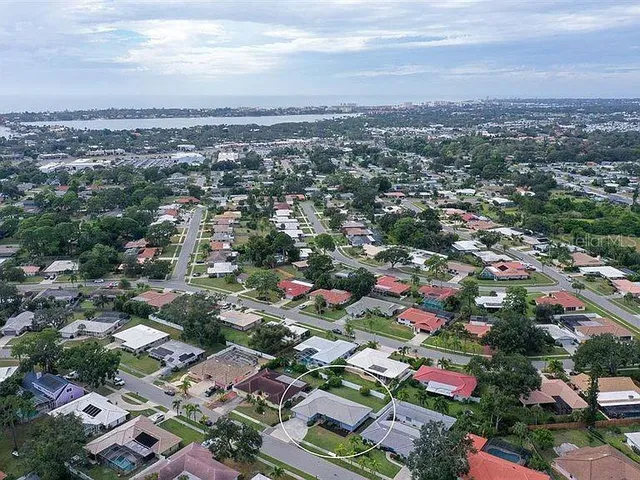 an aerial view of residential building with city view